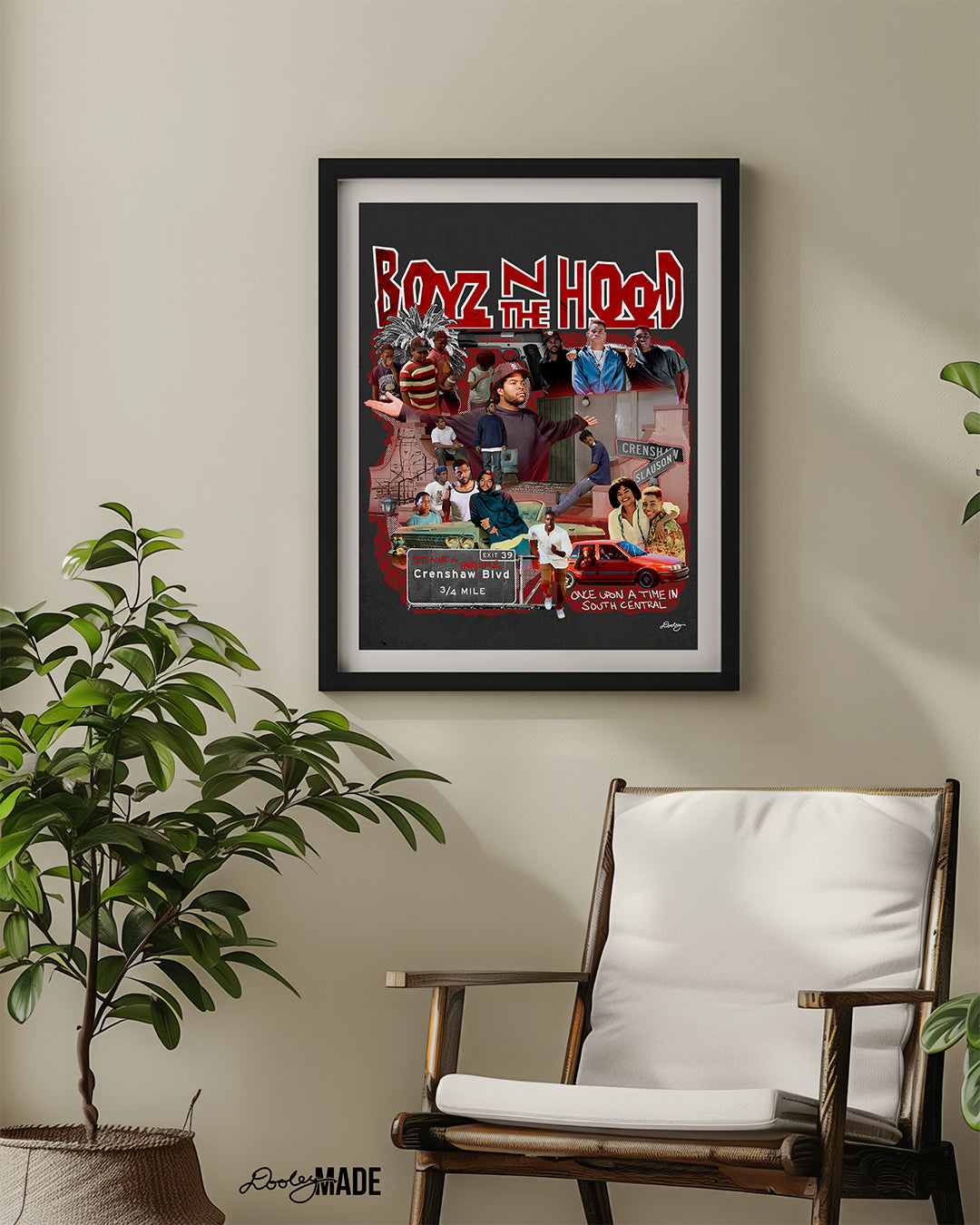 A premium Boyz N The Hood artwork and print wall decor featuring a detailed collage of restored scenes and characters from the iconic 90s movie in a black picture frame on a eggshell wall, sitting above a chair and green plant. A perfect art piece to add life to a space.