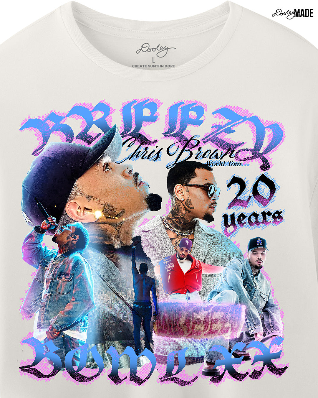 A zoomed in Vintage White crop top t-shirt with a pink, blue, and black graphic that says 'Breezy Bowl XX,' 'Chris Brown World Word Tour' and '20 Years.' The graphic also features a collection of stylized Chris Brown photos with pink and blue highlights.