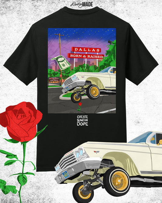 An image of premium black shirt from The Dallas Concrete Rose Collection featuring a vibrant illustration by Dre Dooley of a classic 1964 Chevy Impala lowrider with gold wire wheels, hopping in the streets of Dallas. A red street sign reads "Dallas Born & Raised", set against a sunset city skyline. A floating $100 bill, power lines, and urban elements reflect the culture of Dallas, TX. A single red rose grows from a cracked street, symbolizing resilience and roots.