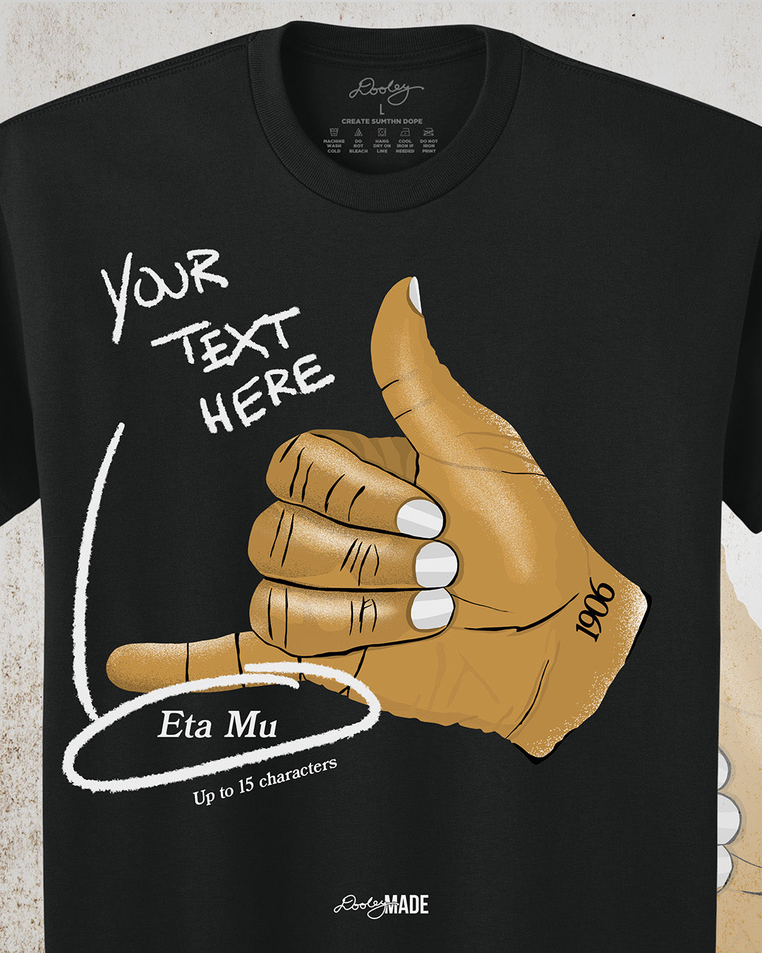 A customizable Black t-shirt with an old gold Alpha Phi Alpha Fraternity, Inc. "ICE" hand sign with "1906" text on the wrist. Image on grunge textured white background. Text on image 'Your Text Here' and 'Eta Mu'.