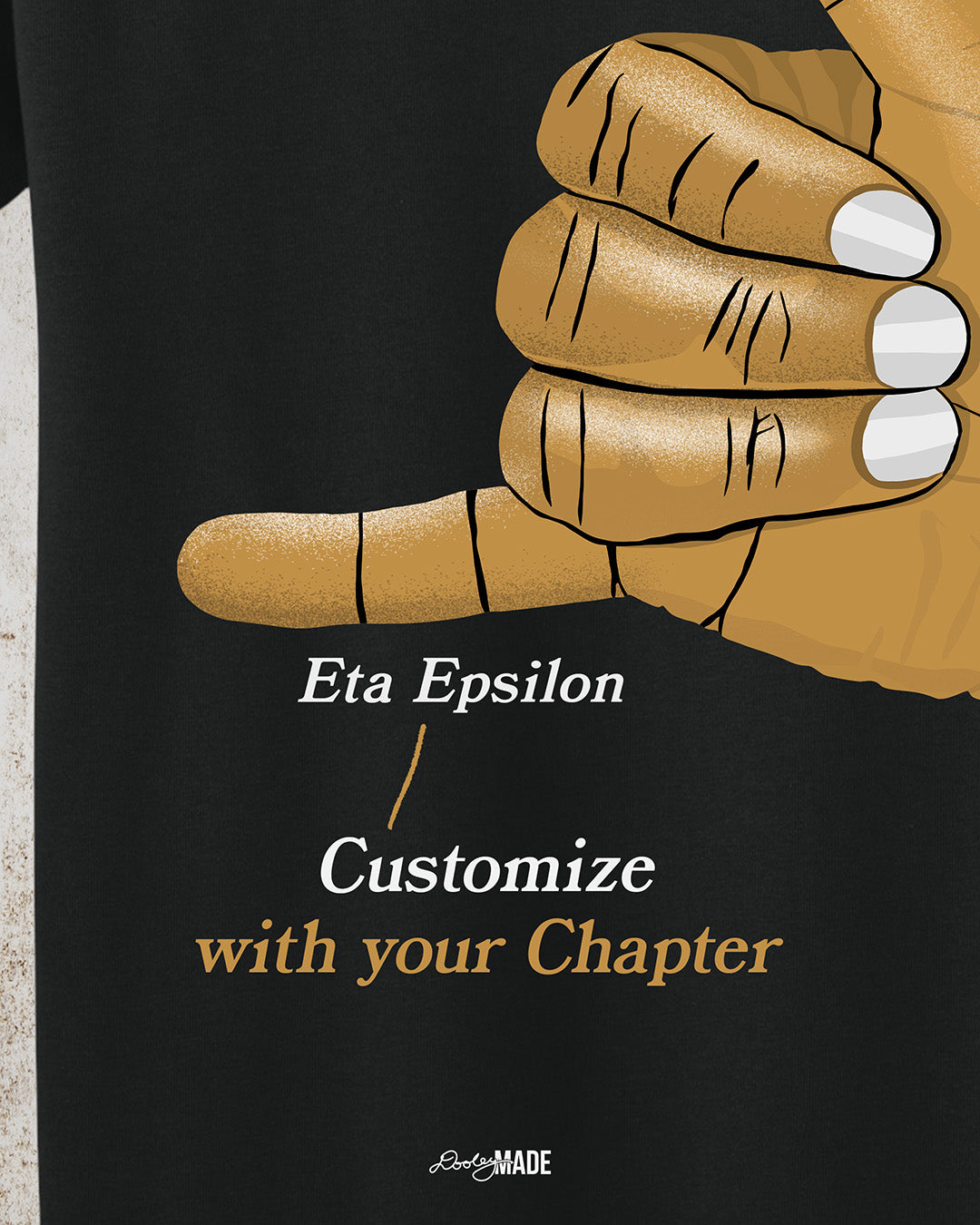 A customizable Black t-shirt with an old gold Alpha Phi Alpha Fraternity, Inc. "ICE" hand sign. The words "customize with your chapter" are listed to show customization option.