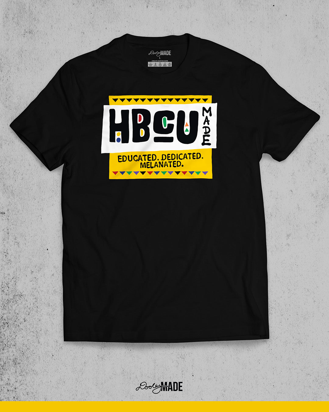 A premium black shirt featuring a bold HBCU Made 90s Martin Show themed design featuring the text "Educated, Dedicated, Melanated. The design is white, black, yellow, and various other vibrant colors.