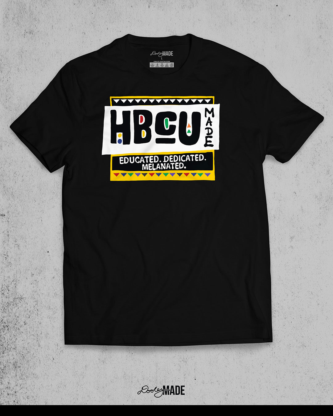 A premium black shirt featuring a bold HBCU Made 90s Martin Show themed design featuring the text "Educated, Dedicated, Melanated. The design is white, black, yellow, and various other vibrant colors.