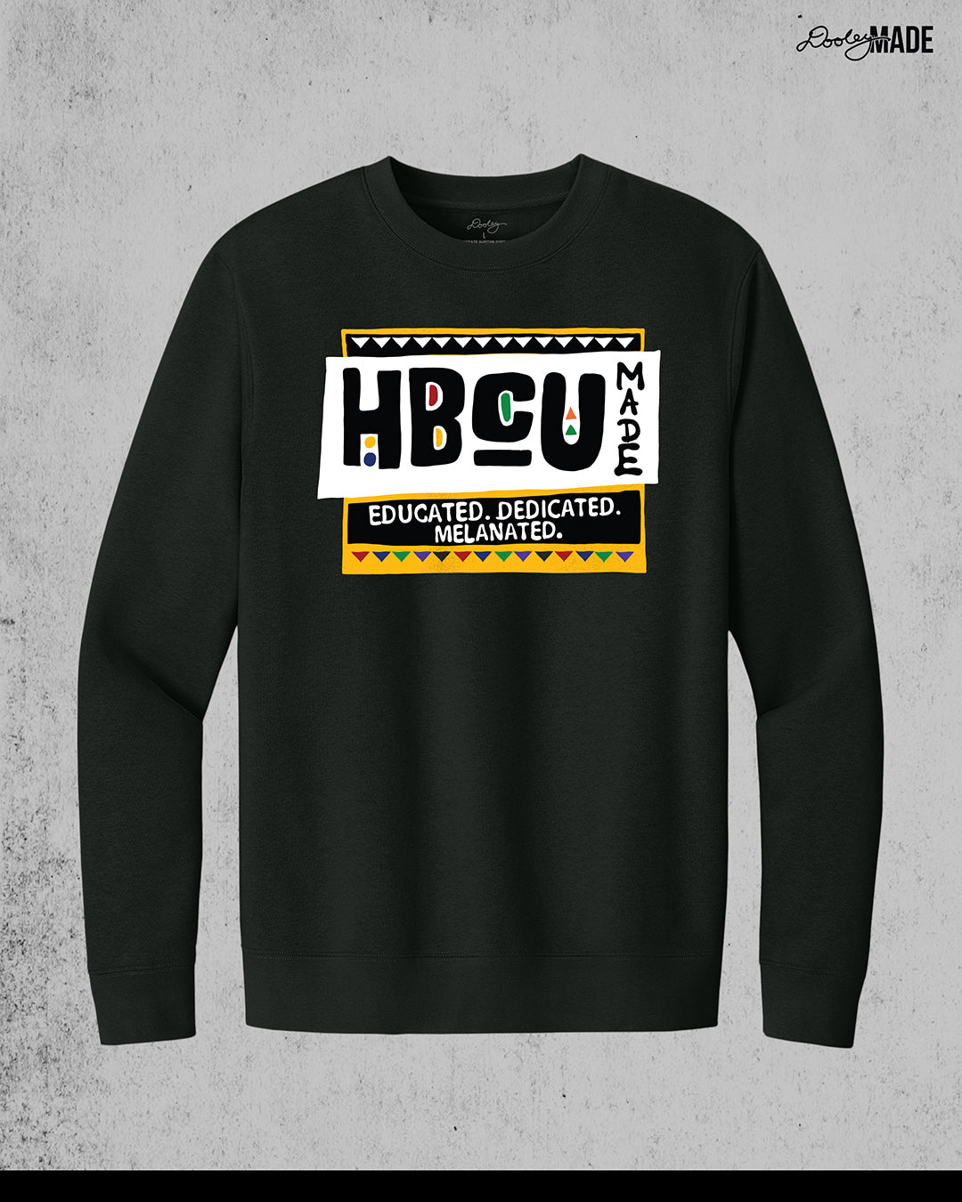 A premium black crewneck sweater featuring a bold HBCU Made 90s Martin Show themed design featuring the text "Educated, Dedicated, Melanated. The design is white, black, yellow, and various other vibrant colors.