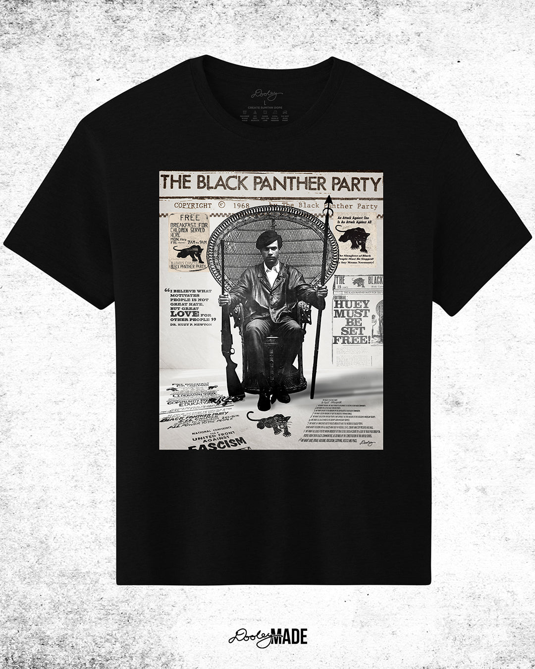 A graphic tee shirt with an image of Huey P. Newton artwork featuring the Black Panther Party's 10 Point Program, a poster that hung inside the door of the Chicago Chapter headquarters, the quote "I believe what motivates people is not great hate, but great love for other people," and other historical memorabilia.