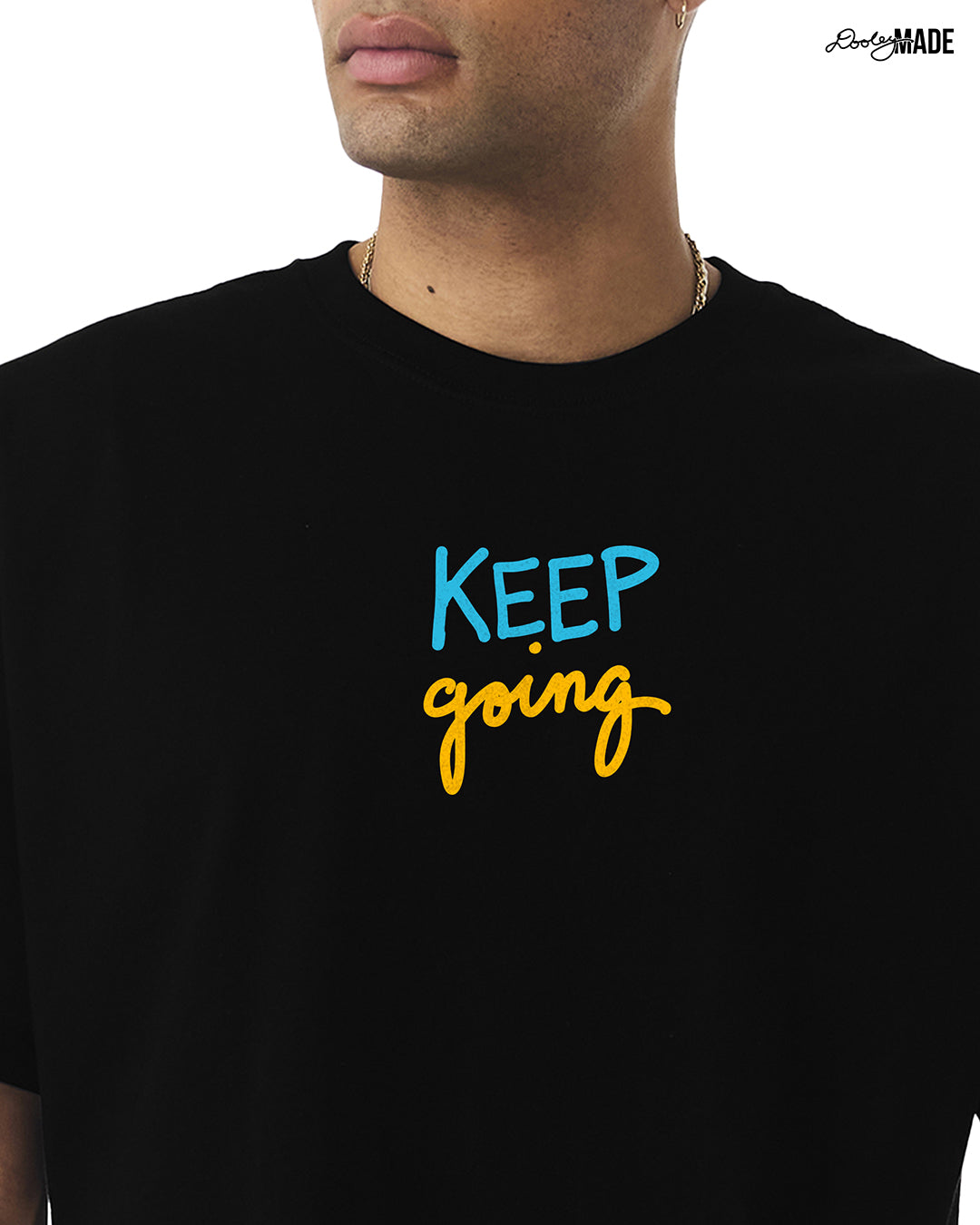 A heavyweight Black t-shirt with 'KEEP going' text in blue and yellow on the front on a white background.