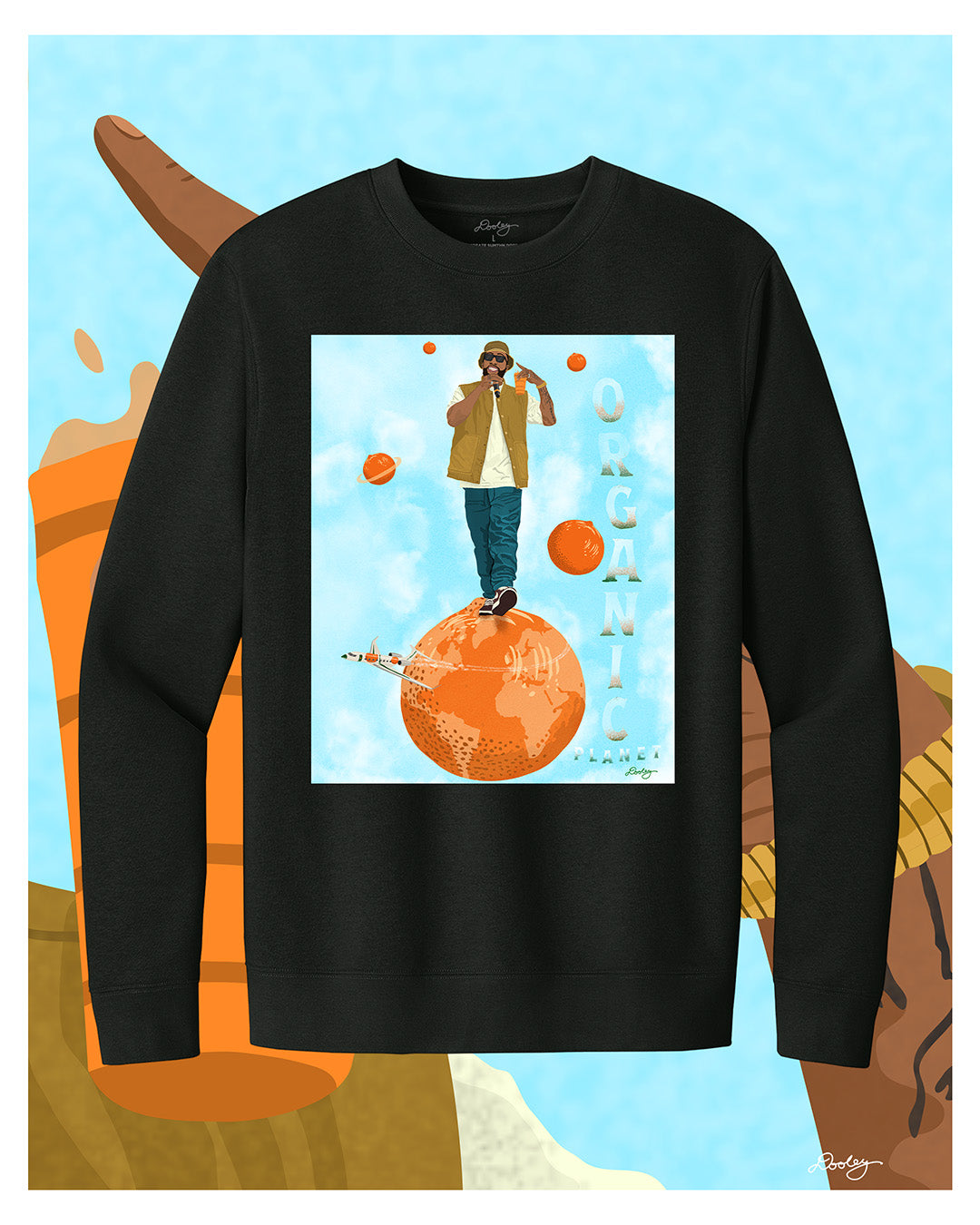 A black Larry June themed graphic crewneck sweatshirt featuring a Larry June illustration of him standing on an orange planet with smaller floating orange planets, alongside the text "Organic Planet." Bold casual wear design blending creativity, luxury, and hip-hop culture.