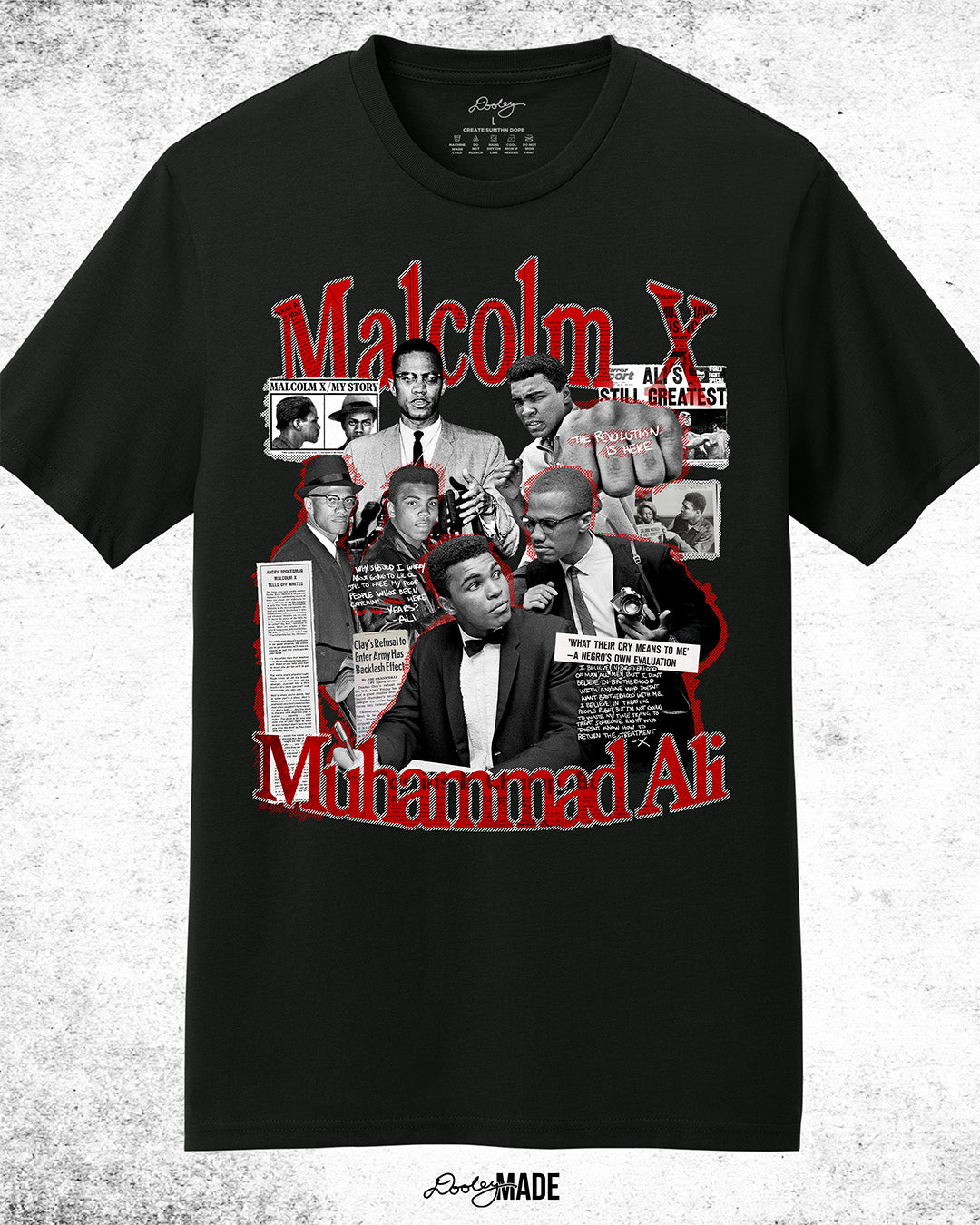 The front of a Black t-shirt featuring a collage of Malcolm X and Muhammad Ali with newspaper headlines and photos, with Malcolm X & Ali in bold red and white text. On a white background.