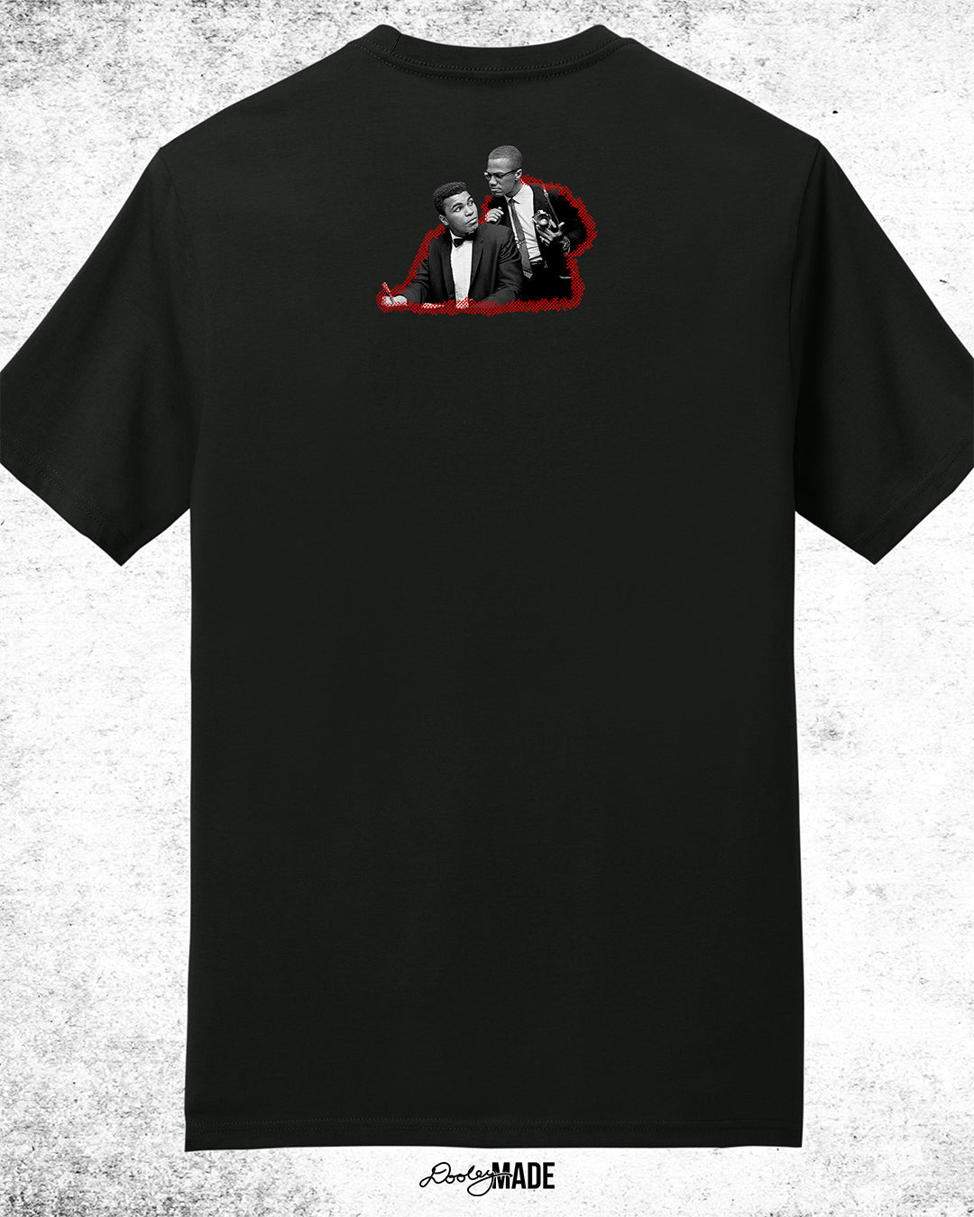 The back of Black t-shirt featuring a collage of Malcolm X and Muhammad Ali with newspaper headlines and photos, titled 'Malcolm X & Ali: Blood Brothers' in bold red and white text