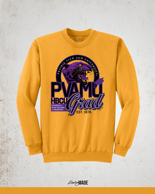 A gold Prairie View A&M graduation crewneck sweatshirt featuring a roaring panther surrounded by a circular frame with Prairie View A&M University inside of it, and the words "PVAMU Grad" next to Historically Black Colleges & Universities.