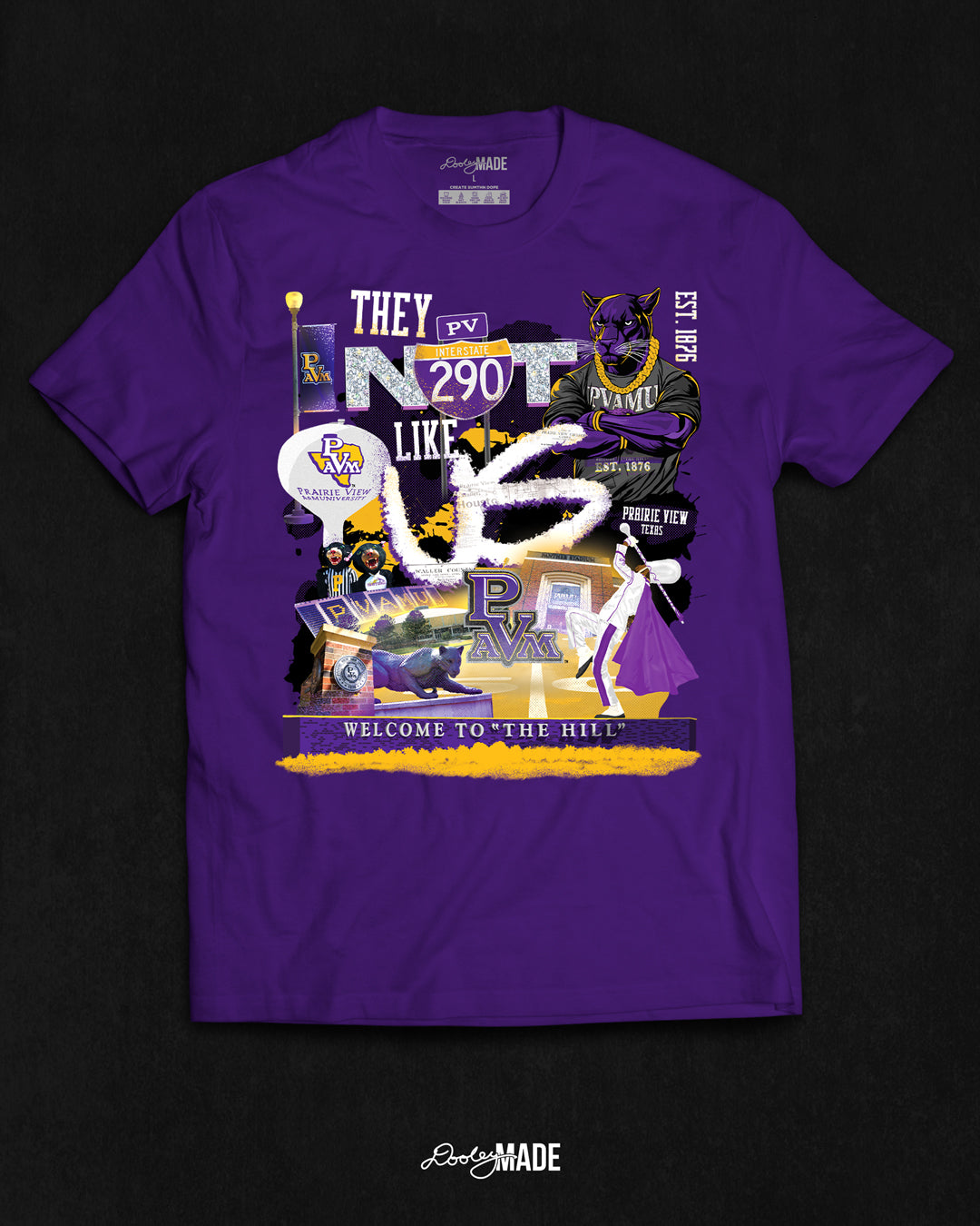 A "They Not Like Us" themed Prairie View A&M shirt featuring a vibrant collage with a hand drawn elements: a panther panther wearing a gold chain, an interstate 290 sign, the PV water tower, mascots, a marching storm drum major, the panther statue and the "Welcome to the Hill" sign.