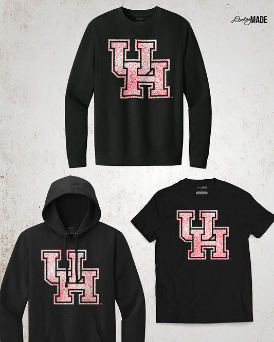 Image showing a black University of Houston crewneck sweatshirt, hoodie, and shirt with a shirt UH logo with red speckles.