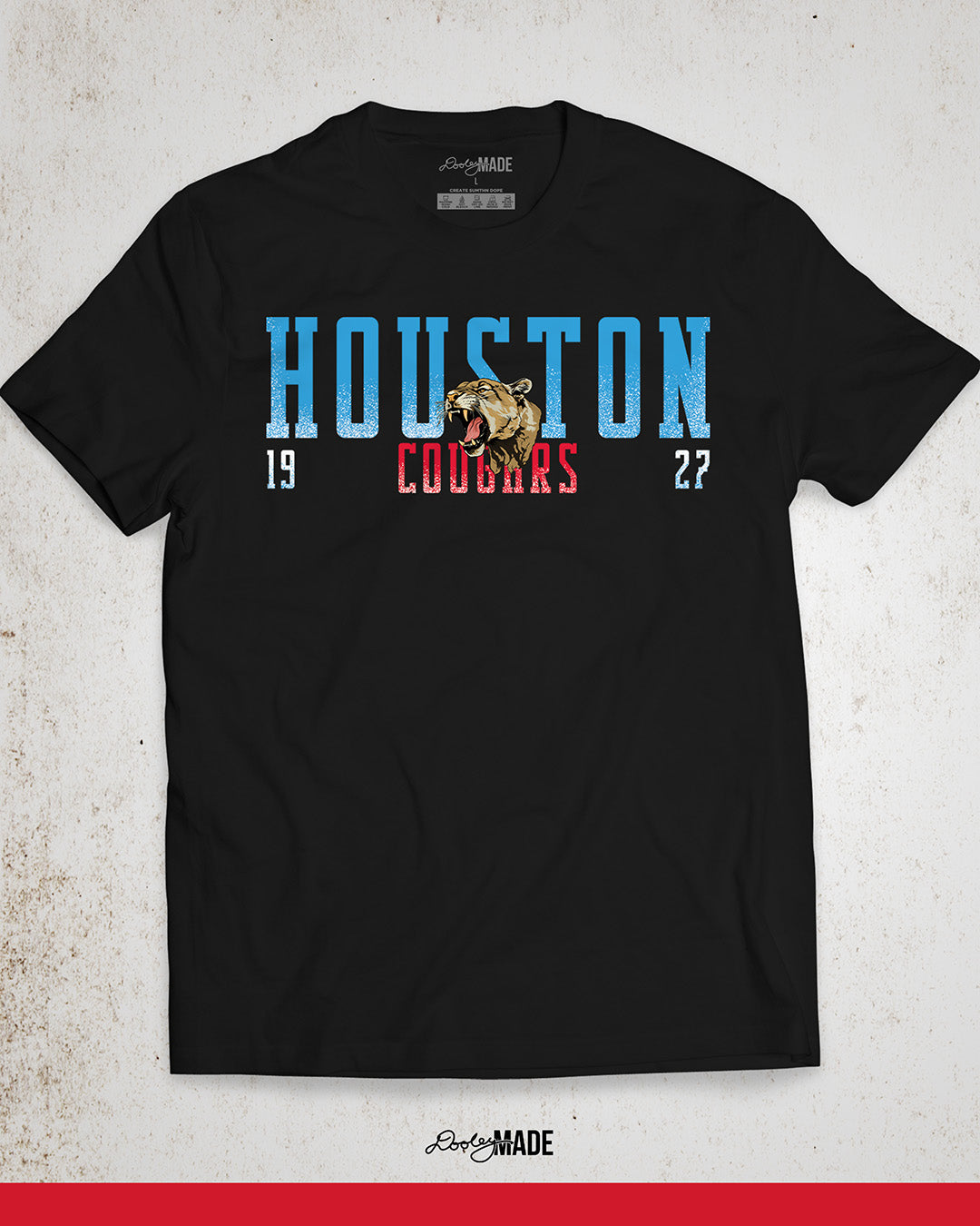 A black University of Houston Cougars themed shirt with "Houston" written in Oiler Blue block text with a roaring cougar straddling the word Houston. The text "Cougars" is below in white and 1927 is split below in white. The text contains a white grunge texture on its lower half. Perfect for alumni, students, and fans.