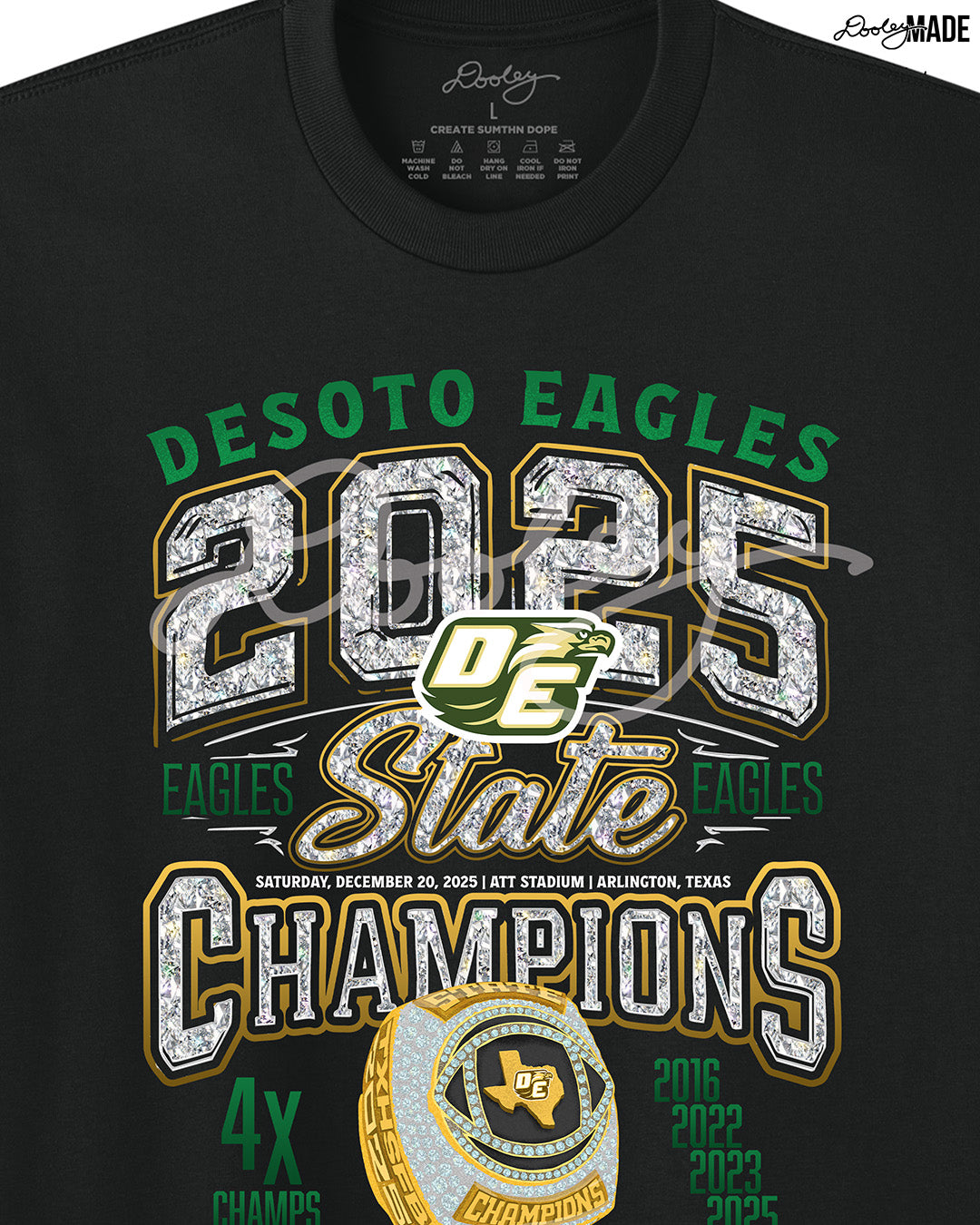 Zoomed in Black Shirt with 'Desoto Eagles 2025 State Champions' text in diamonds and amd golden champion ring design with 4 time champions an and championship years (2016, 2022, 2023, 2025.