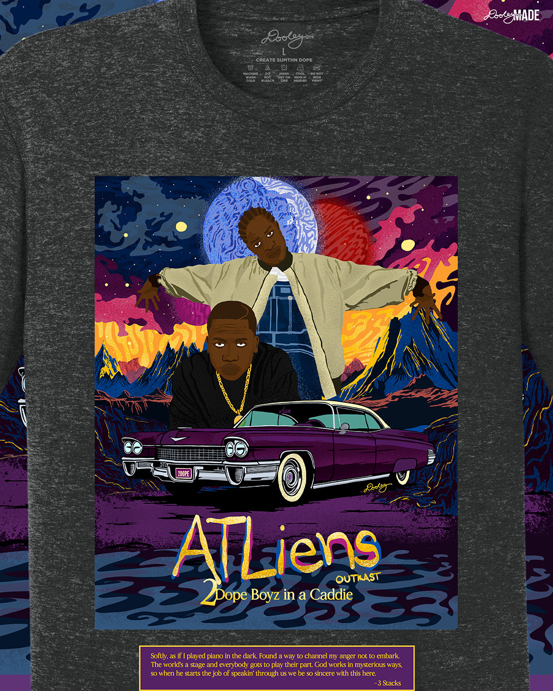 A zoomed heather black OutKast shirt featuring a custom out of this world illustration and an old school Cadillac, capturing the essence and colorful complexity of OutKast's extra-terrestrial rhymes. There is also an Andre 3000 quote from the song "2 Dope Boys in a Cadillac."