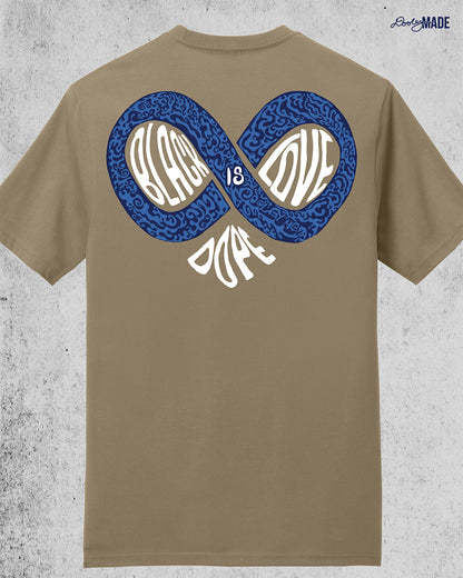An image of the back of a desert tan colored shirt reading "Black Love is Dope" featuring an infinity symbol that combines with the word "Dope" to make the shape of a heart.  