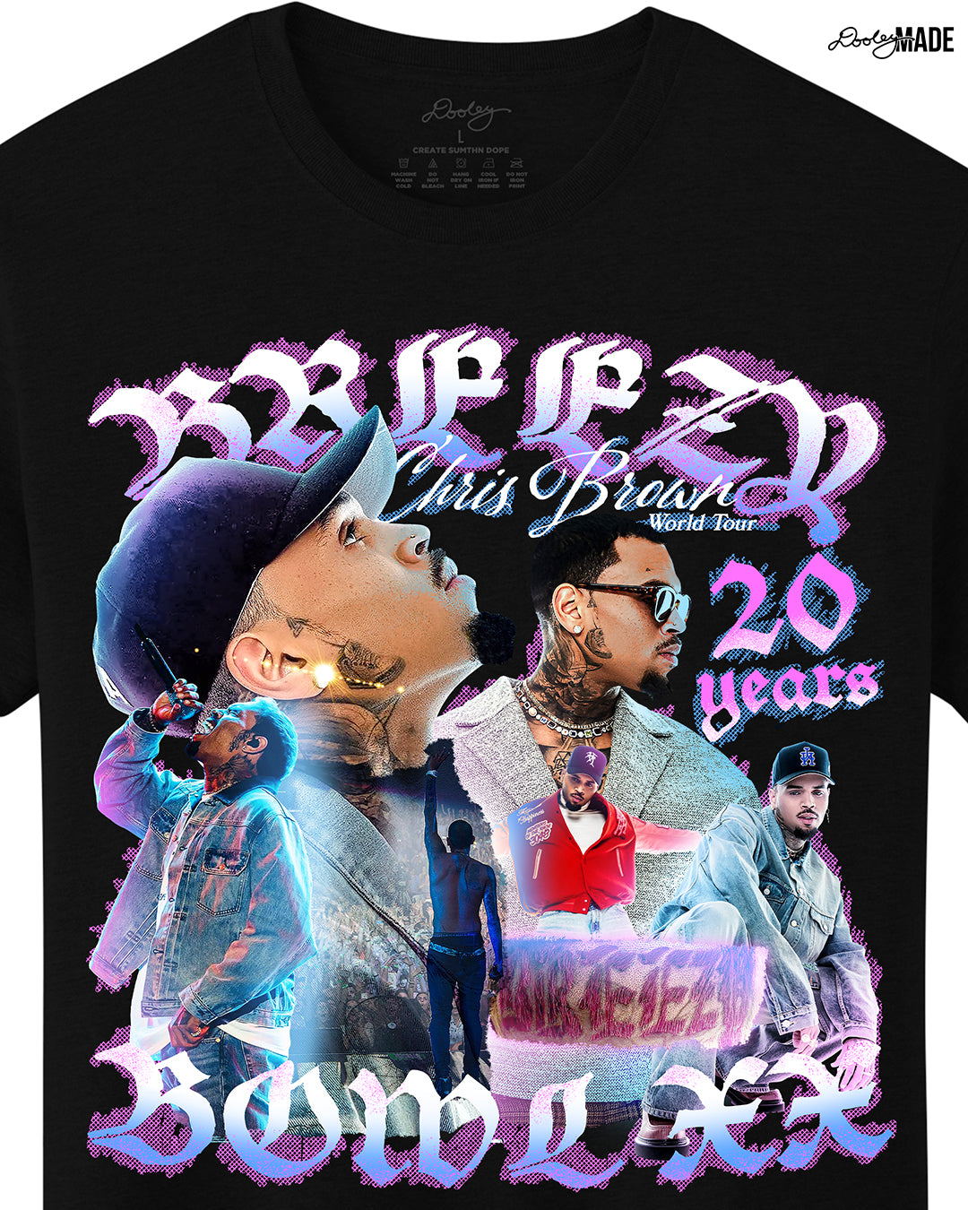 A zoomed in black oversized heavyweight t-shirt with a pink, blue, and white graphic that says 'Breezy Bowl XX,' 'Chris Brown World Word Tour' and '20 Years.' The graphic also features a collection of stylized Chris Brown photos with pink and blue highlights. 