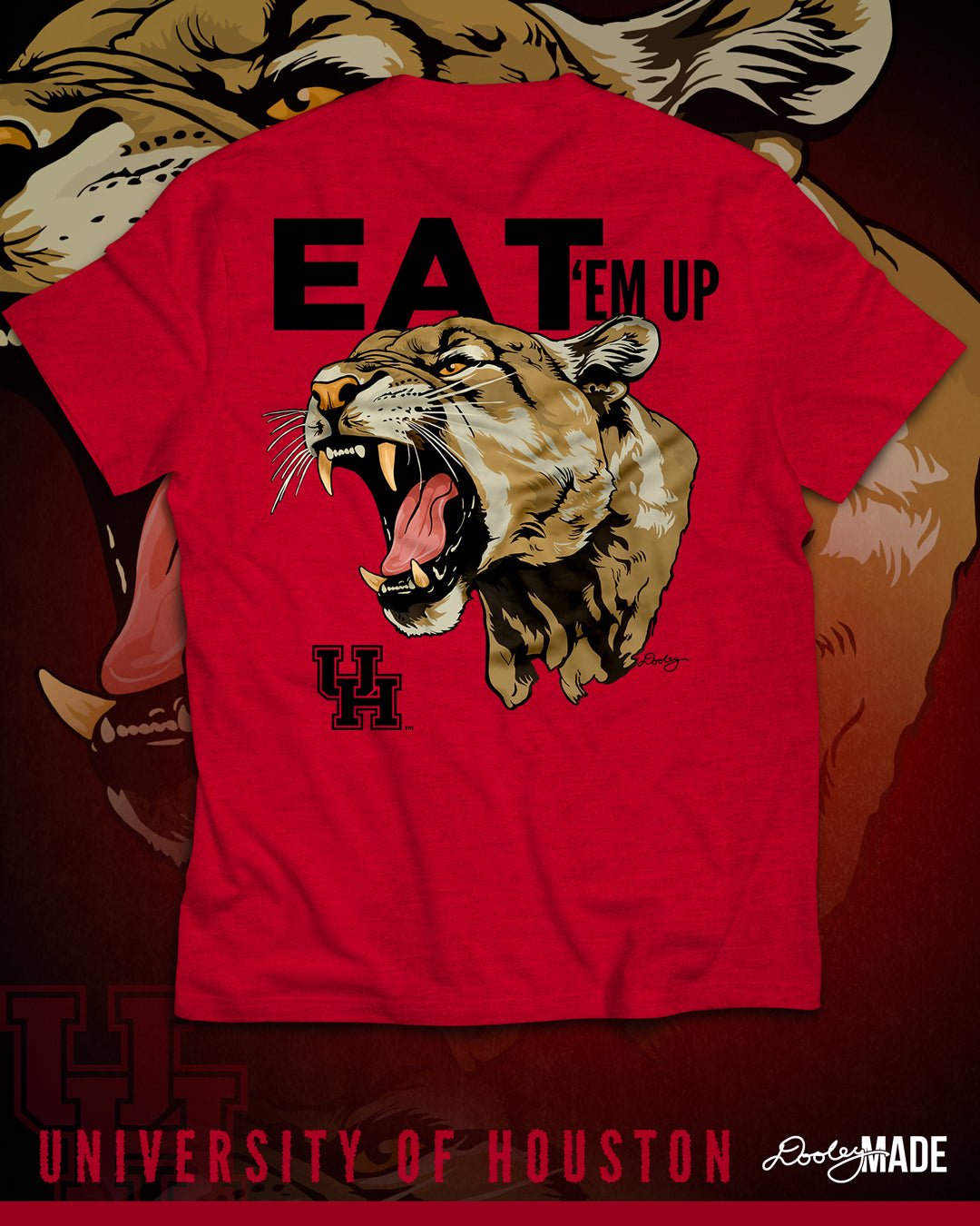 The back of a heather red University of Houston shirt featuring a large roaring cougar printed on the back with the words "Eat 'Em Up" above it in a bold font, and the UH logo underneath to the left. 