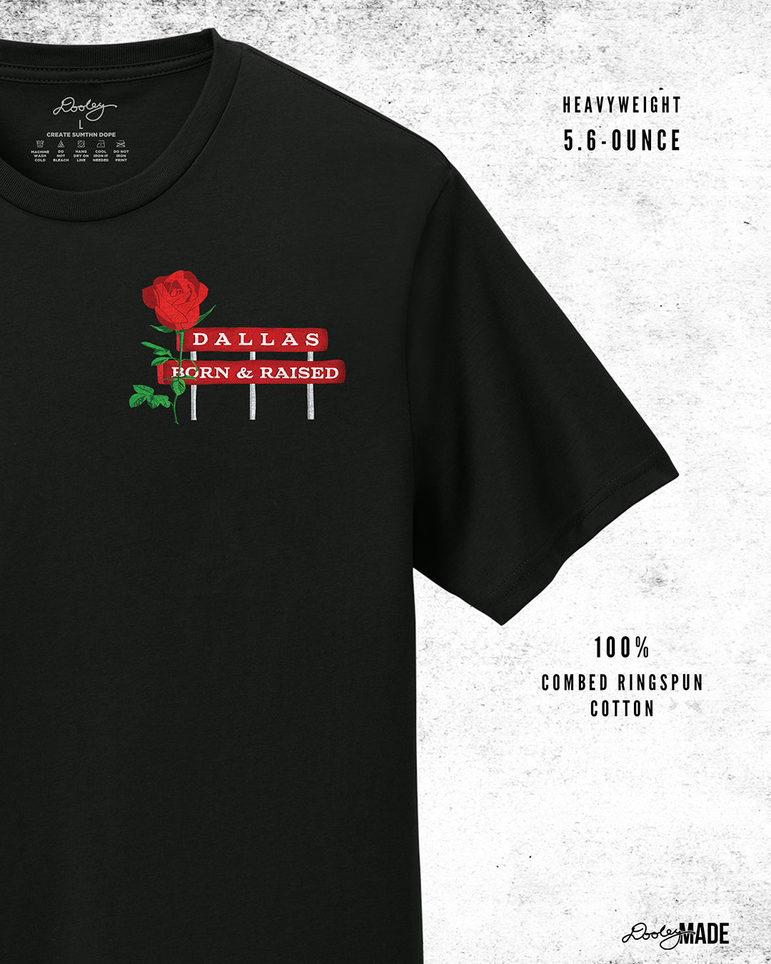 An image of premium black shirt from The Dallas Concrete Rose Collection featuring a vibrant illustration by Dre Dooley of a Rose and a sign reading "Dallas Born and Raised" on the left chest. 
