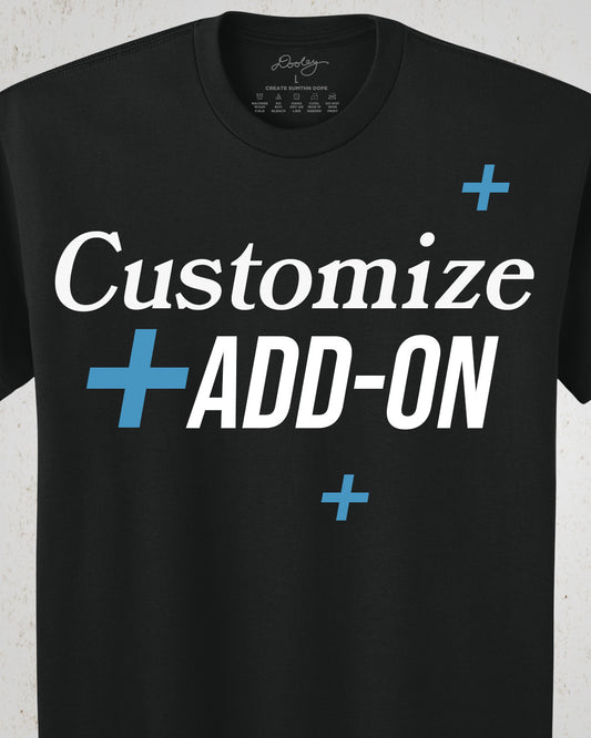 Black t-shirt with text 'Customize + Add-On' on a white background. Image is showing Dooley Made Custom Products Add On.