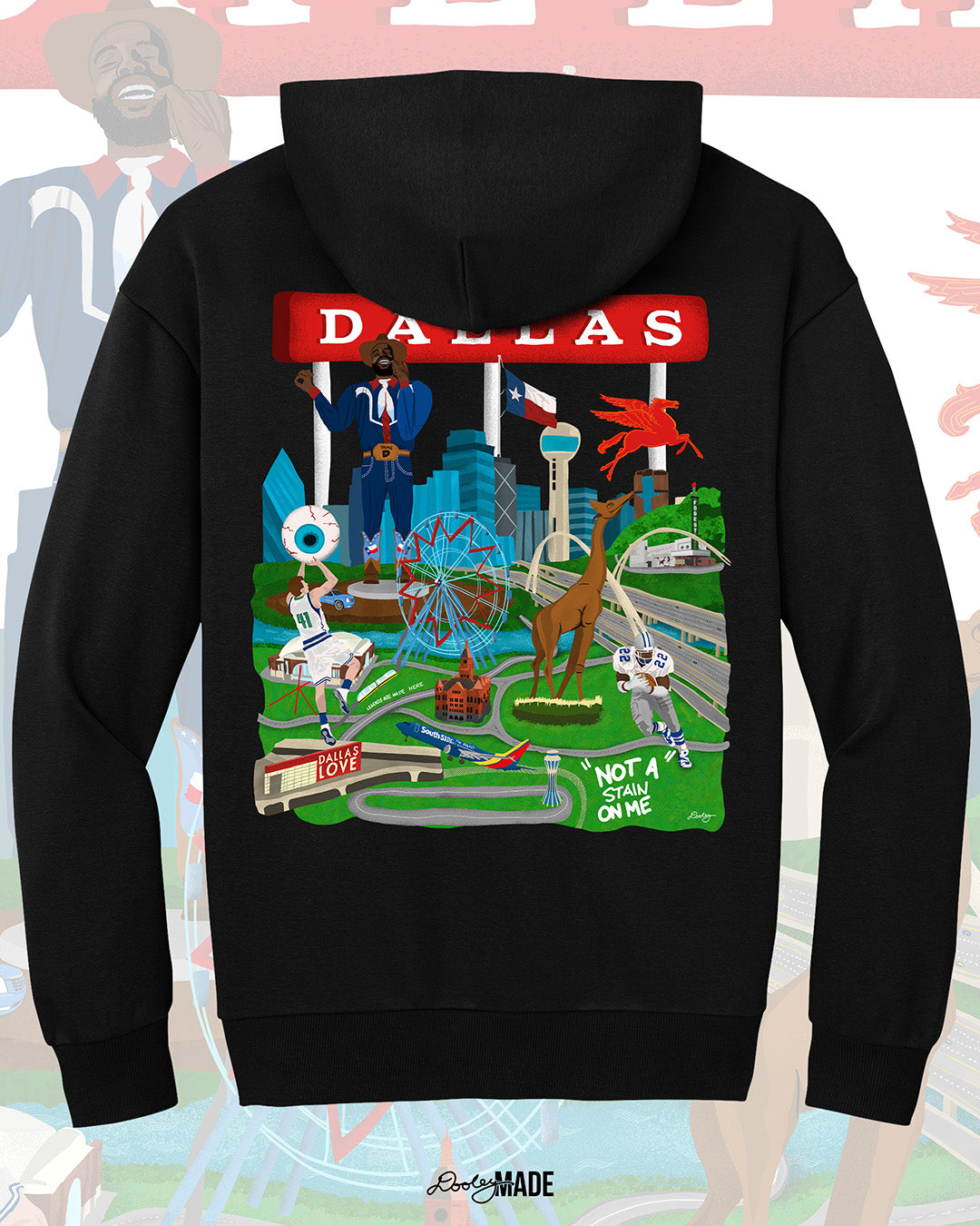 The back of a Dallas themed heavyweight 340 gsm hoodie with the text "Dallas" in red and illustrated Dallas landmarks like the Dallas skyline, "Triple D Big Tex and the Texas Star Ferris Wheel at the State Fair of Texas, legendary Dallas athletes, Dallas Love Field Airport, Dallas Zoo giraffe statue, and the Margaret Hunt Hill Bridge. Background shows zoomed in details of the shirt's artwork.
