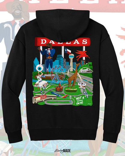 The back of a Dallas themed heavyweight 340 gsm hoodie with the text "Dallas" in red and illustrated Dallas landmarks like the Dallas skyline, "Triple D Big Tex and the Texas Star Ferris Wheel at the State Fair of Texas, legendary Dallas athletes, Dallas Love Field Airport, Dallas Zoo giraffe statue, and the Margaret Hunt Hill Bridge. Background shows zoomed in details of the shirt's artwork.