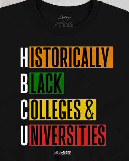 Black crewneck sweatshirt featuring bold block text reading "Historically Black Colleges & Universities" in red, yellow, green, and orange—HBCU pride apparel.