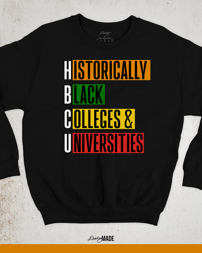 Black crewneck sweatshirt featuring bold block text reading "Historically Black Colleges & Universities" in red, yellow, green, and orange—HBCU pride apparel.