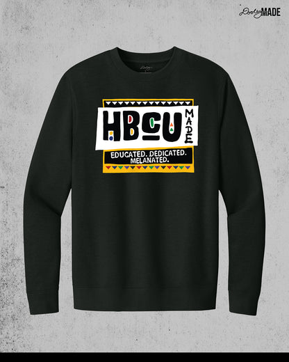 A premium black crewneck sweater featuring a bold HBCU Made 90s Martin Show themed design featuring the text "Educated, Dedicated, Melanated. The design is white, black, yellow, and various other vibrant colors.
