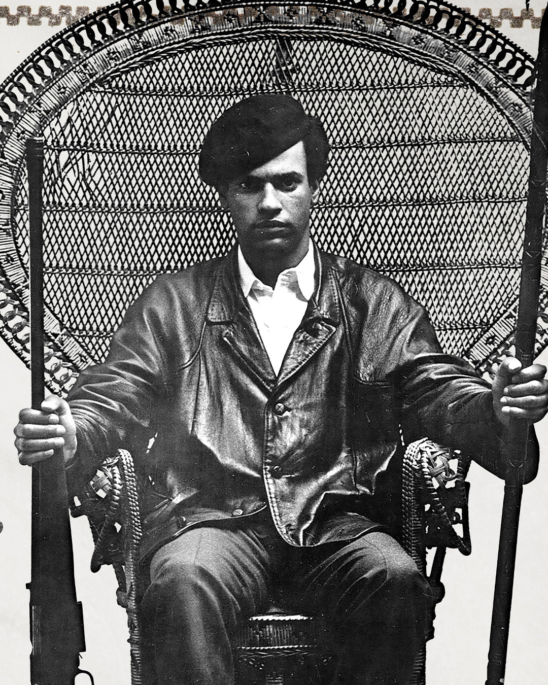 An zoomed image of Huey P. Newton artwork showing him sitting in a woven chair wearing a black leather jacket, dark colored pants, and a black cap while holding the barrel of a rifle in one hand and a wooden spear in the other.