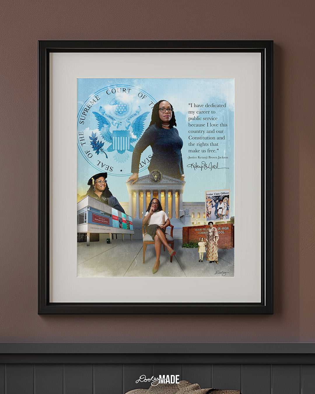 An image of a black picture frame on a brown wall in a sitting room showing a collage honoring Justice Ketanji Brown Jackson. It showcases key moments from her life and career. The central figure is a confident Justice Jackson standing in front of the Supreme Court seal. To the left, she is depicted at her Harvard Law School graduation, with the school's building in the background. 