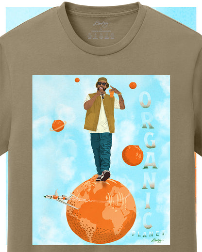 A khaki tan Larry June themed graphic t-shirt featuring a Larry June illustration of him standing on an orange planet with floating orange planets, alongside the text "Organic Planet." Bold casual wear design blending creativity, luxury, and hip-hop culture. Zoomed to show detail.