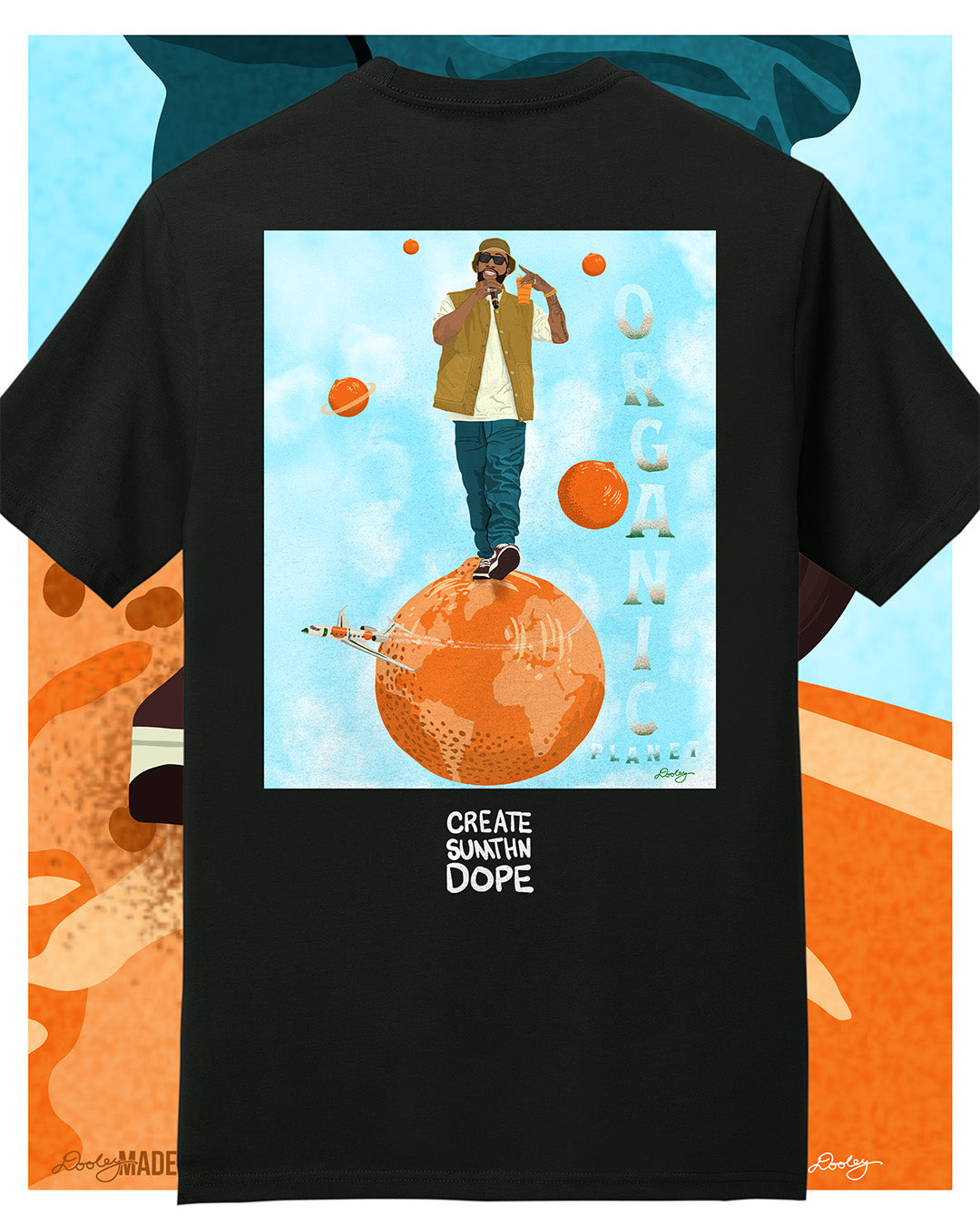 A black Larry June themed graphic t-shirt featuring a Larry June illustration of him standing on an orange planet with floating orange planets, alongside the text "Organic Planet" and "Create Sumthin Dope." Bold streetwear design blending creativity, luxury, and hip-hop culture.