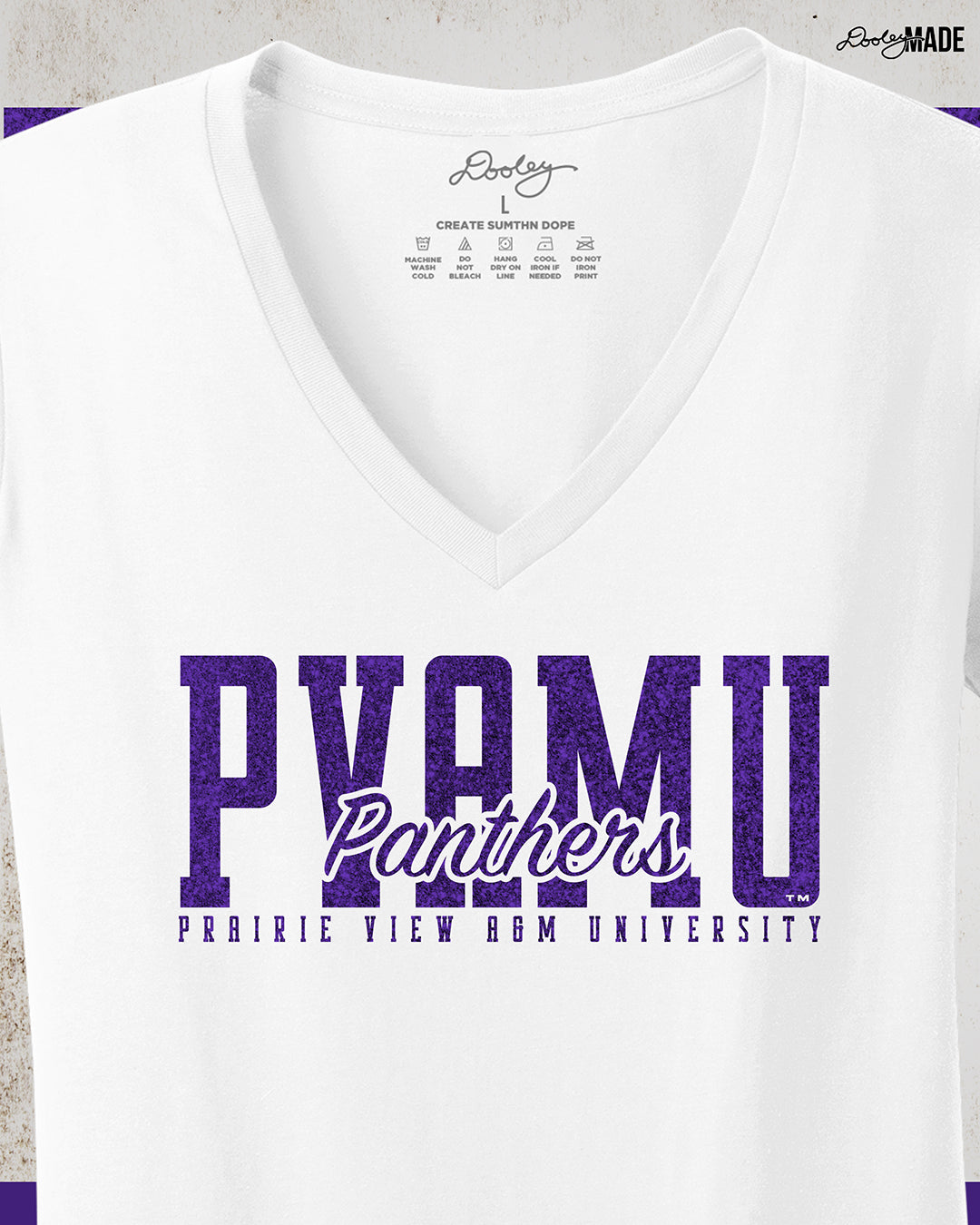 A premium white Prairie View A&M University ladies v-neck shirt with a shinny purple glitter PVAMU Panther design across the chest. Perfect for alumni, students, and gradates that want to celebrate their HBCU pride. 