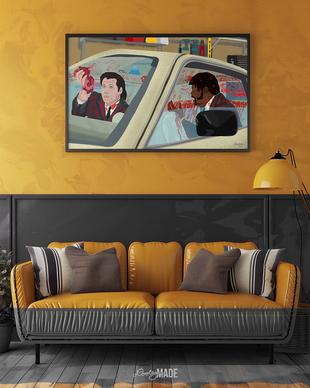 An image showing a framed photo of a stylized illustration by Dre Dooley titled "The Accident" depicting a scene from the movie Pulp Fiction on yellow/gold wall in a room with a shinny yellow couch. Covered in blood, Samuel L. Jackson and John Travolta argue while cleaning blood and brain from a car's interior as it sits in a garage. 