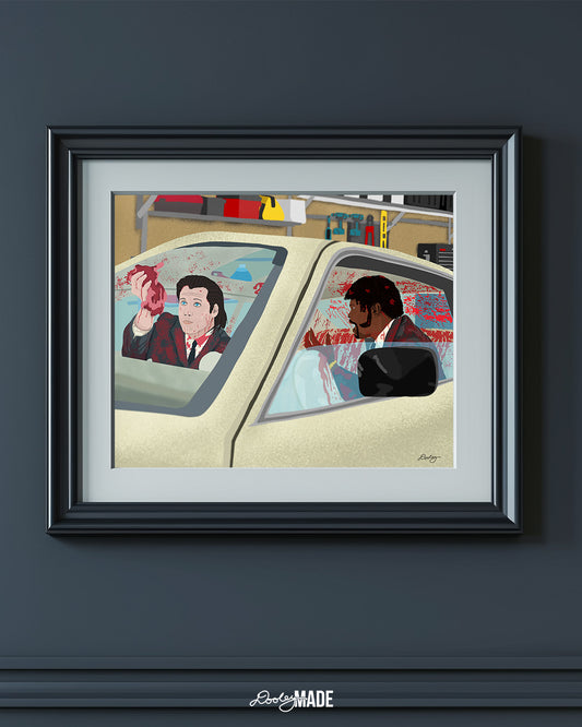 An image showing a framed photo of a stylized illustration by Dre Dooley titled "The Accident" depicting a scene from the movie Pulp Fiction on blue wall.  Covered in blood, Samuel L. Jackson and John Travolta argue while cleaning blood and brain from a car's interior as it sits in a garage. 