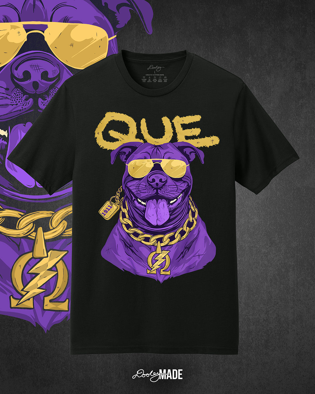 A photo of a black shirt with a graphic of an Omega Psi Phi Fraternity, Inc themed Pit Bull Dog wearing gold aviator sunglasses and a gold Omega Psi Phi necklace.
