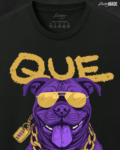 A zoomed in photo of the top of a white shirt with a graphic of an Omega Psi Phi Fraternity, Inc themed Pit Bull Dog wearing gold aviator sunglasses and a gold Omega Psi Phi necklace.