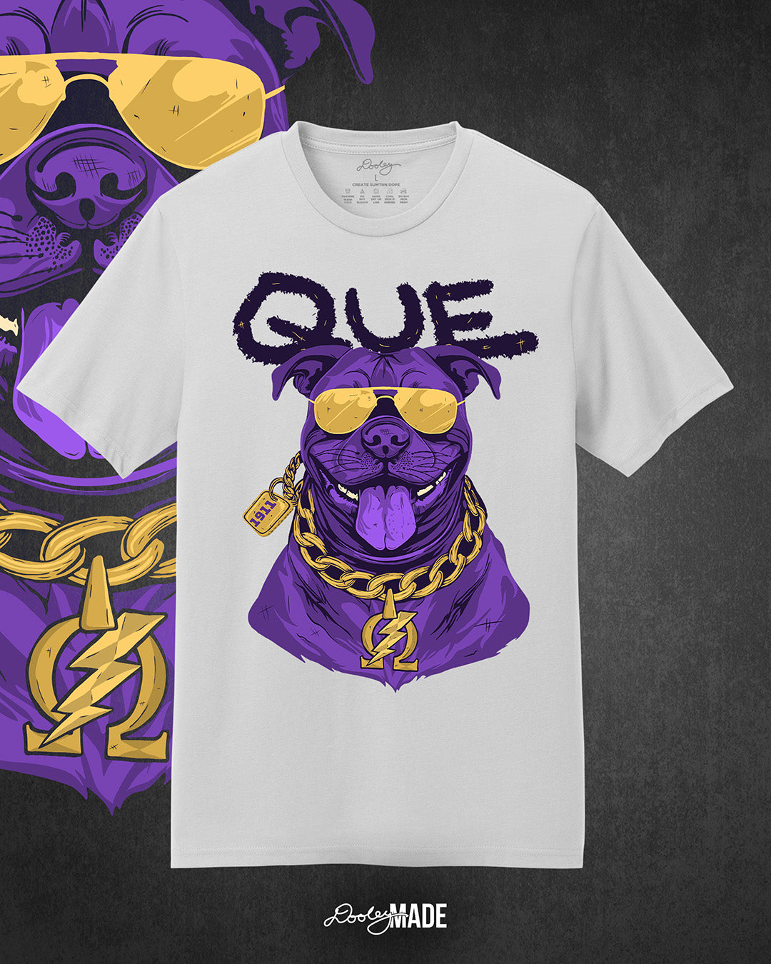 A photo a white shirt with a graphic of an Omega Psi Phi Fraternity, Inc. themed Pit Bull Dog wearing gold aviator sunglasses and a gold Omega Psi Phi necklace.