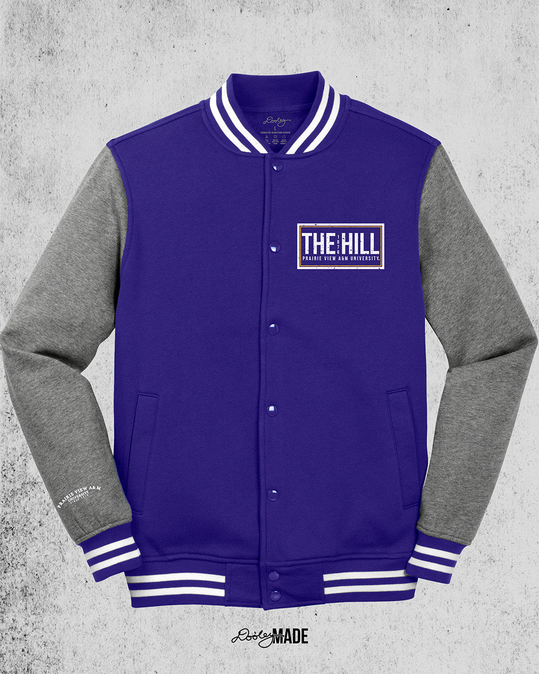 Purple and heather gray Prairie View A&M Fleece Varsity Letterman Jacket. The front left chest has 'The Hill' and 'Prairie View A&M University' text printed in white inside of a rectangular box.