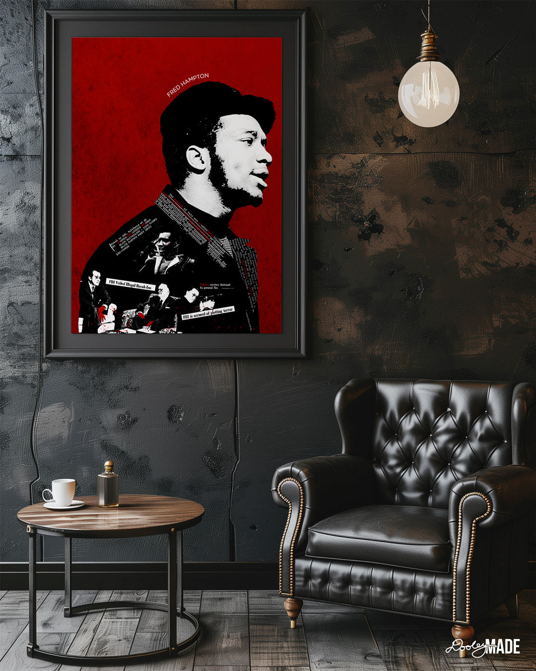 A black picture frame hug on a wall in a sitting room of a red, black and white Fred Hampton artwork depicting the FBI’s nefarious “Cointel-Pro” program and their pursuit and assassination of Black Political Leaders.