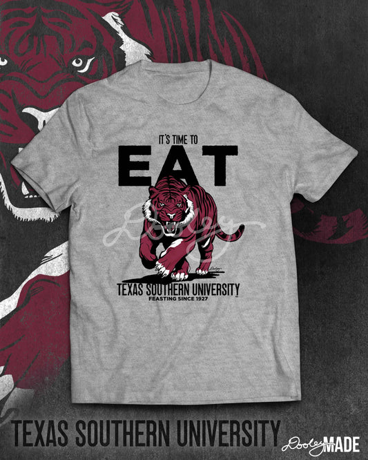 Image of a heather grey Texas Southern University shirt with the words "It's Time to Eat" in bold and a prowling aggressive maroon tiger. The words "Texas Southern University" are below the tiger followed by "Feasting since 1927."