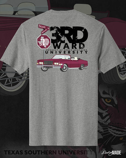 An image of the back of a heather gray Texas Southern University graphic tee shirt featuring a 3rd Ward University design and a maroon old school car with elbow rims. There is also a stop sign with the Texas Southern University logo on it and with the Scott St and Wheeler Ave intersection signs. 