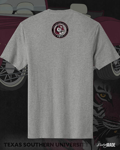An image of the back of a heather gray Texas Southern University graphic tee shirt featuring a 3rd Ward University design and a maroon old school car with elbow rims. There is also a Scott St and Wheeler Ave street sign with a stop sign with the Texas Southern University logo on it. The the back shows a circular print with the words Texas Southern University Established 1927 Houston, Tx  around the border with a stylized tiger inside of it. 