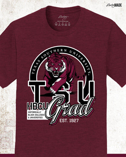 An athletic maroon Texas Southern University graduation shirt featuring a prowling tiger surrounded by a circular frame with the university name inside of it, and the words "TSU Grad" next to HBCU and Historically Black Colleges & University. Zoomed to show details.