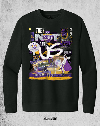 A "They Not Like Us" themed Prairie View A&M black crewneck sweater featuring a vibrant collage with a hand drawn elements: a panther panther wearing a gold chain, an interstate 290 sign, the PV water tower, mascots, a marching storm drum major, the panther statue and the "Welcome to the Hill" sign.  