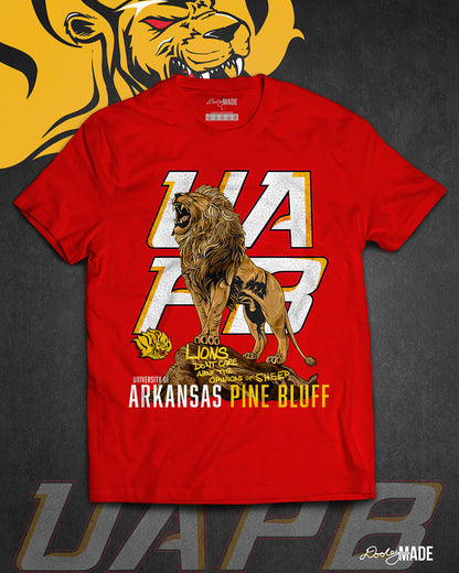The front of a red University of Arkansas Pine Bluff graphic tee shirt with the slogan "Lions Don't Care About The Opinions of Sheep" on the front with a Lion roaring on top of a rock in front of a stylized UAPB logo.