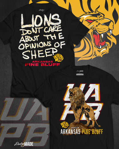 The front and back of a University of Arkansas Pine Bluff graphic tee shirt with the slogan "Lions Don't Care About The Opinions of Sheep" on the back and a Lion roaring on top of a rock in front of a stylized UAPB logo.
