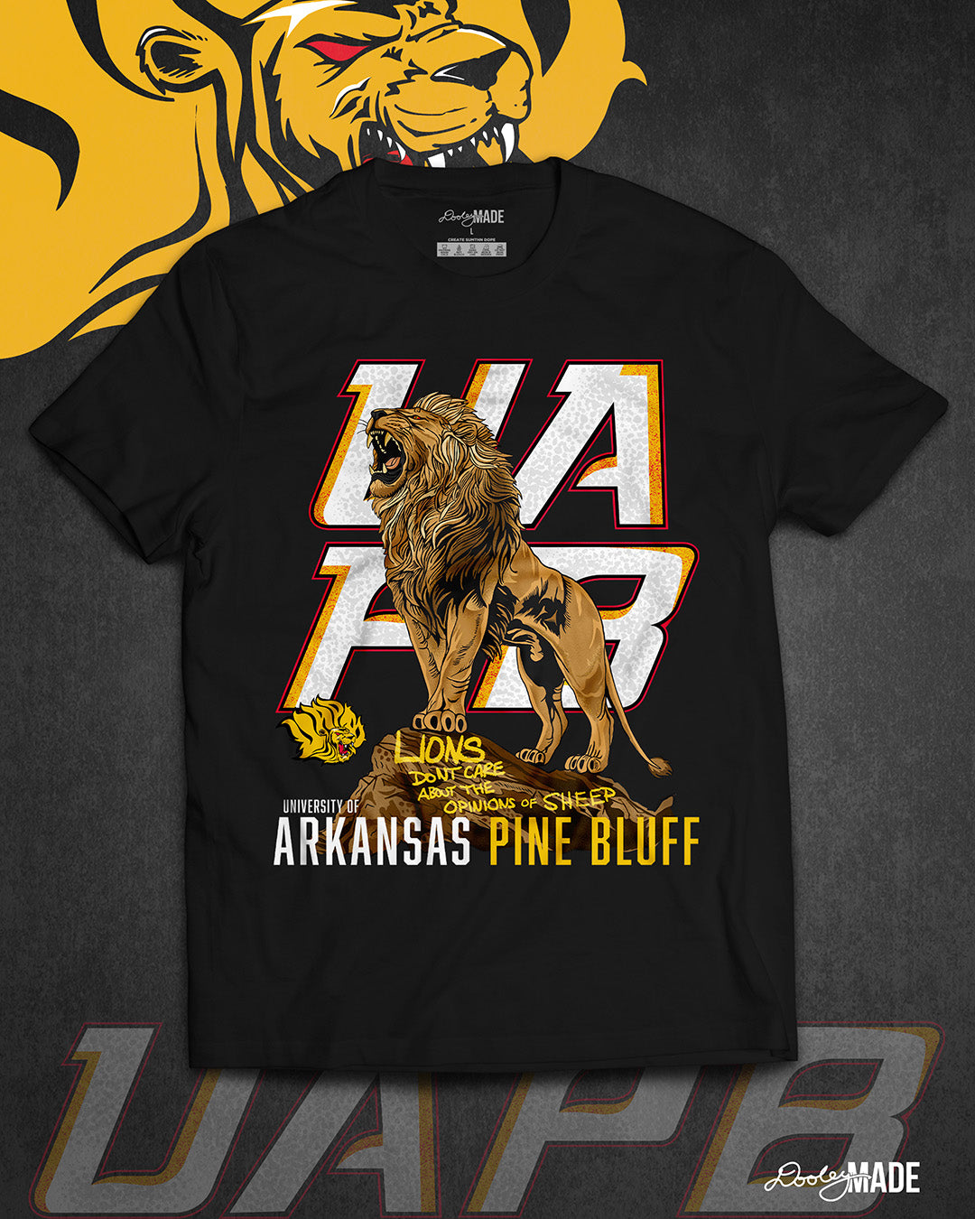 The front of a black University of Arkansas Pine Bluff graphic tee shirt with the slogan "Lions Don't Care About The Opinions of Sheep" on the front with a Lion roaring on top of a rock in front of a stylized UAPB logo.
