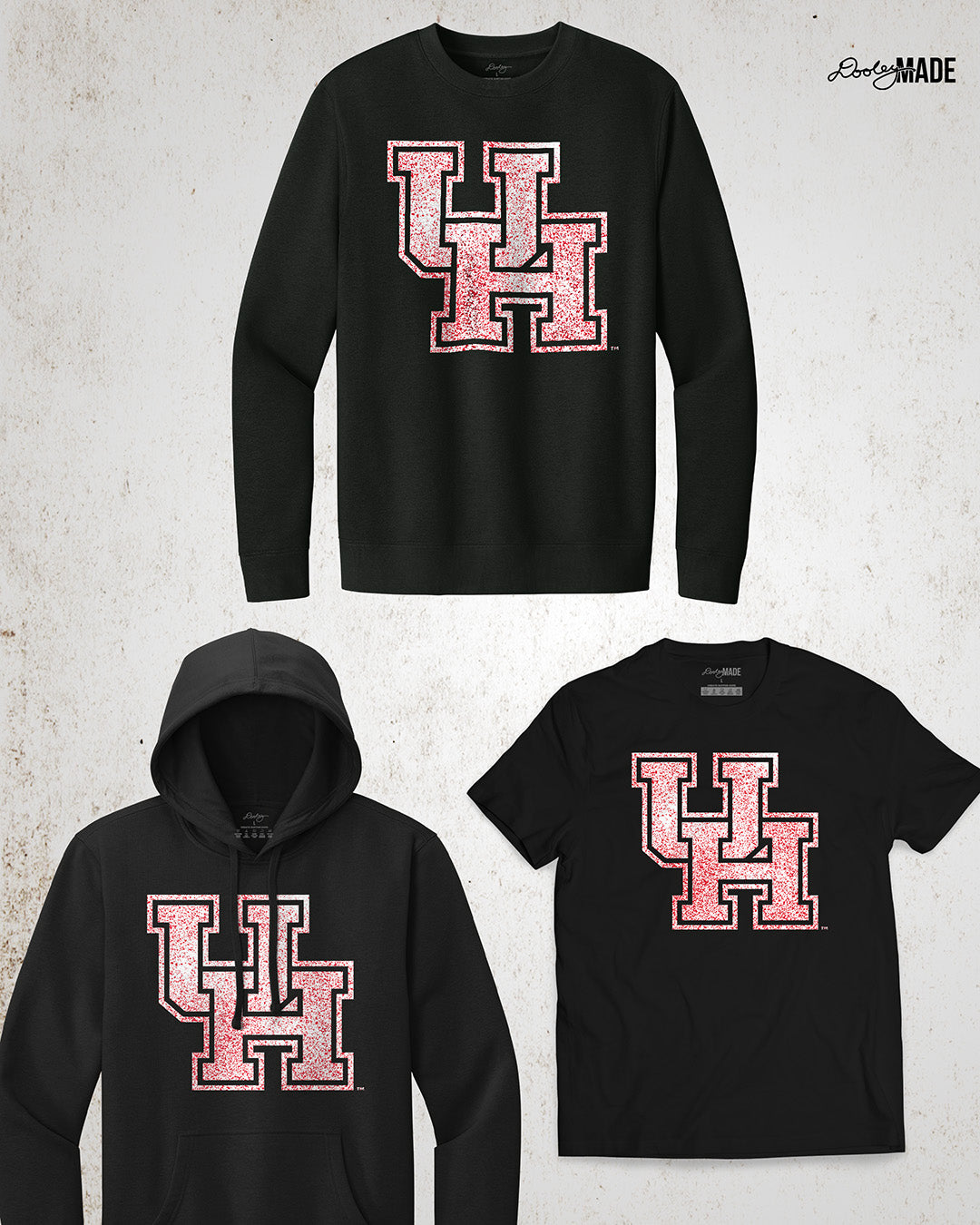Image showing a black University of Houston crewneck sweatshirt, hoodie, and shirt with a shirt UH logo with red speckles. 